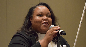 Marilyn Green, president of the NFB of Illinois, speaks to the convention.