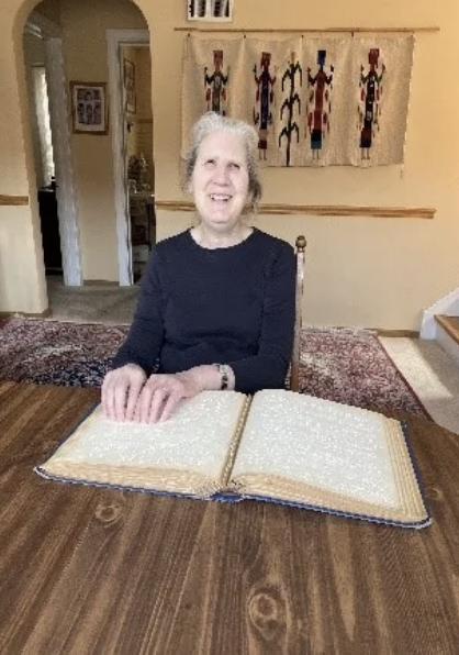 A woman reading braille